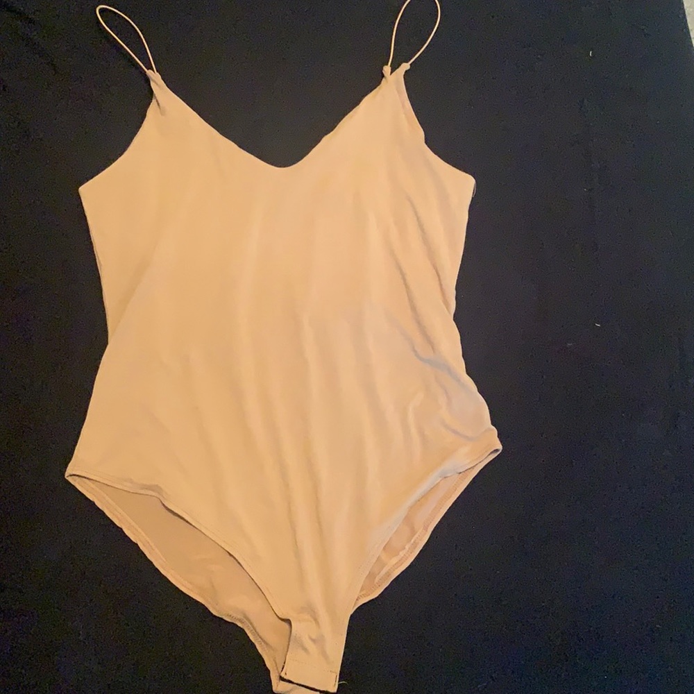 Tan bodysuit. Never worn. Still has tags